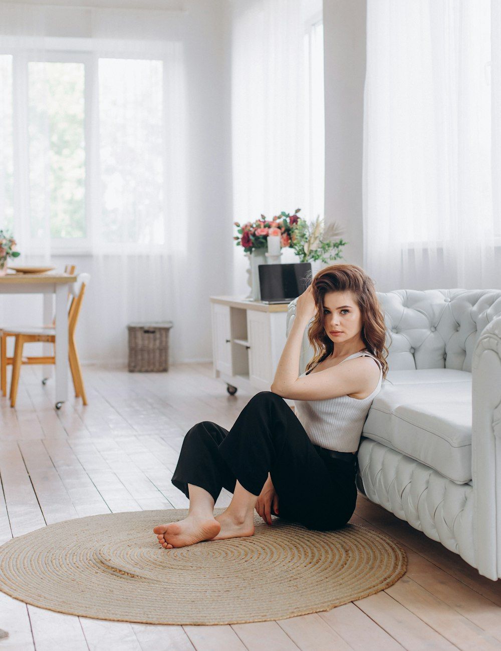 A host at home in a bright, calm living room